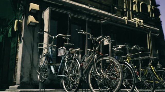 Vintage bicycles parked against stone facade, sunlit iron railings casting long shadows, cobblestone pavement with clustered locked frames, ornate building