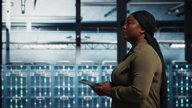 Manager works inside a data center to support equipment checkups, network monitoring, infrastructure upgrades and organized technical operations within a practical data center workflow.