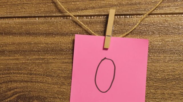 Turquoise-colored sticky notes with the number zero.