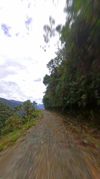 Driving along Death Road Yungas mountain pass Bolivia POV