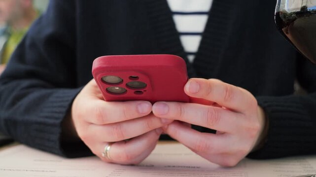 Close-up of hands holding smartphone and using mobile applications. Person reading content, browsing apps and interacting with digital technology. High quality 4k footage