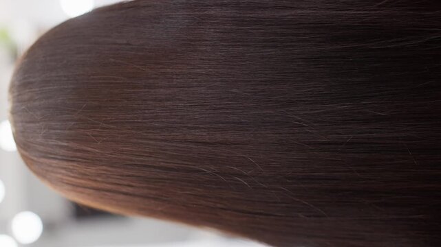 Hair no action observed static frames, in close-up of hair against a neutral background with, with hair, with hair texture, from a close-up top-down perspective perspective, with brown, black accents.
