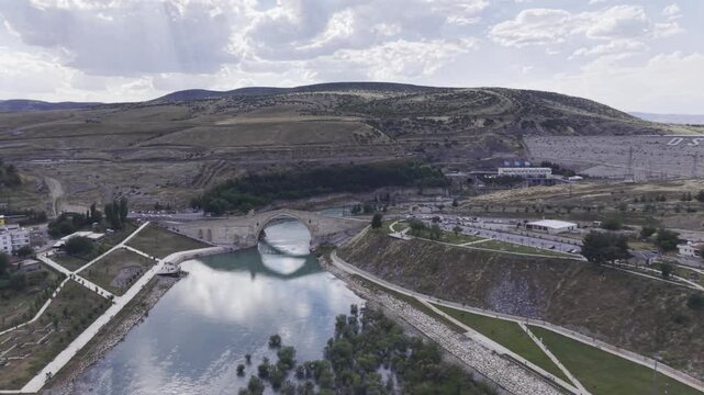 Cinematic View of Malabadi Bridge in Diyarbakir, Turkiye &ndash; Medieval Stone Arch Bridge Above Batman River