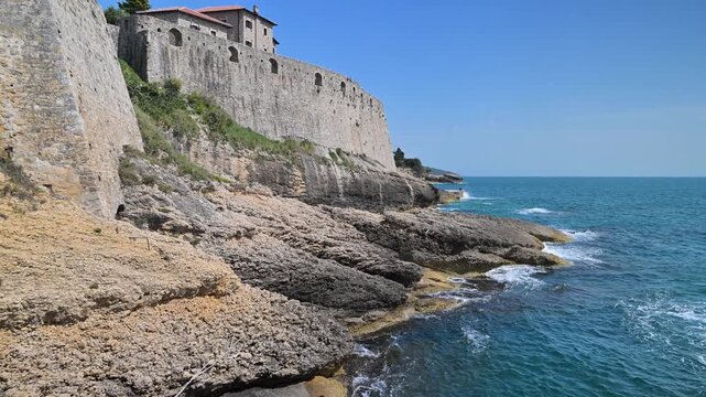 Stone city walls of the old town of Ulcinj in Montenegro overlooking the sea