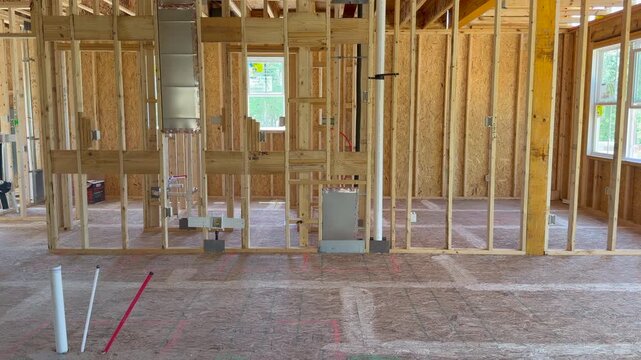 Inside of an unfinished residential property during the structural skeleton stage highlighting high-quality craftsmanship. Perfect for subcontractor inspection and property development projects.