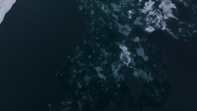 Drone reveal from floating ice on Finsevatnet to the majestic Hardangerj&oslash;kulen glacier in the Norwegian highlands