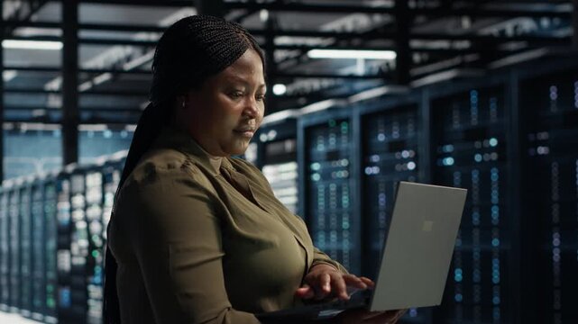 Woman engages with a video wall as online previews communicate social media videos, digital lifestyle, cyberspace content and digital entertainment access across a connected screen experience.