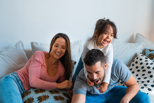 Playful family while taking a selfie together in the sofa