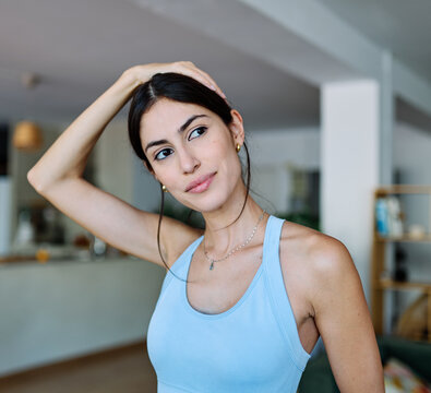 Portrait of a fit woman girl young woman exercising practicing yoga or fitness at home