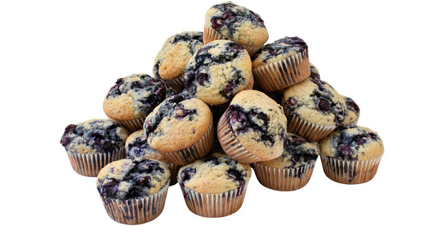 Pile of freshly baked blueberry muffins with visible blueberries, isolated on transparent background