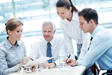 Fototapeta premium Business, meeting or team in office with paper, strategy insight or feedback in budget review. Collaboration, people or finance advisor with document, funding evaluation or forecast in revenue report