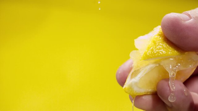 Squeezing out fresh lemon juice at super slow motion at 1000 fps