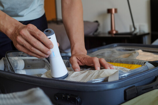 packing a suitcase with vacuum storage bags