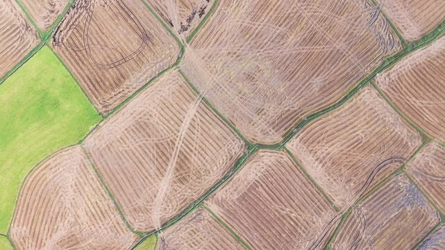 Watch as we travel over Dam Nai Wind Farm in Ninh Thuan, Vietnam. See the wind turbines spinning and the patterns of farmland below in clear weather.