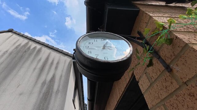 Train Style Clock Close Up On Outdoor Table With Railway Station Look