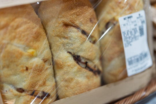close up view of soft bakery bread in transparent packaging