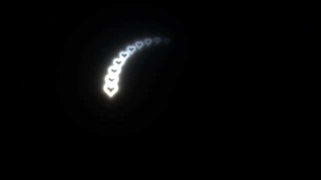 Light shapes form heart patterns in dark background during motion
