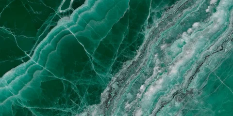 Elegant emerald green onyx marble texture with translucent layers and natural stone veins. © Vidal