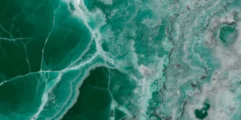 Elegant emerald green onyx marble texture with translucent layers and natural stone veins. © Vidal