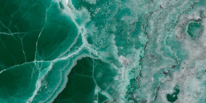 Elegant emerald green onyx marble texture with translucent layers and natural stone veins.