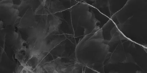 Black onyx marble texture with translucent layers and natural stone veins. © Vidal