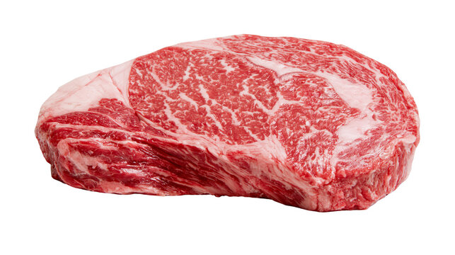Raw marbled beef ribeye steak with thick fat cap, isolated on transparent background