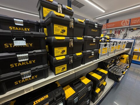 Mallorca, spain, june 27, 2026, stanley and dewalt toolboxes on shelves in hardware store, offering storage solutions for tools and equipment