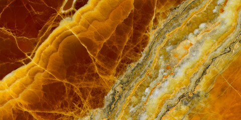 Elegant golden-yellow onyx marble texture featuring translucent layers and natural stone veining. © Vidal