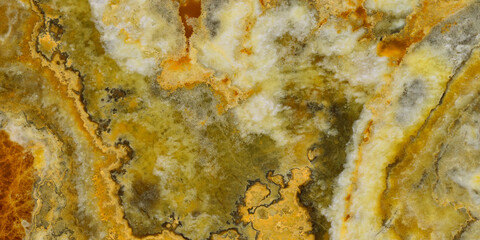 Elegant golden-yellow onyx marble texture featuring translucent layers and natural stone veining. © Vidal