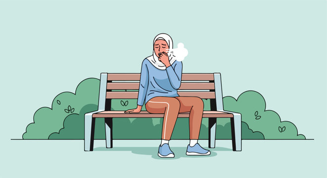 Woman in hijab sitting on a park bench, coughing into her hand