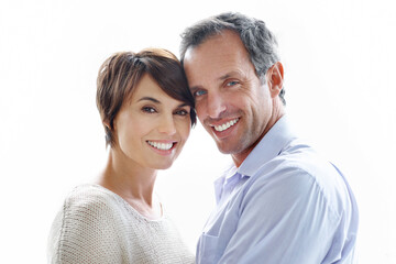 Obraz premium Portrait, happy and couple with love for marriage, care and connection for bonding together. Smile, people and partner admiration with romance, commitment and healthy relationship on white background