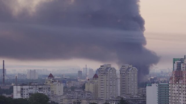 Kyiv, Ukraine - July 2, 2026: Huge column of thick black smoke rising high over the city skyline after a Russian missile and drone attack