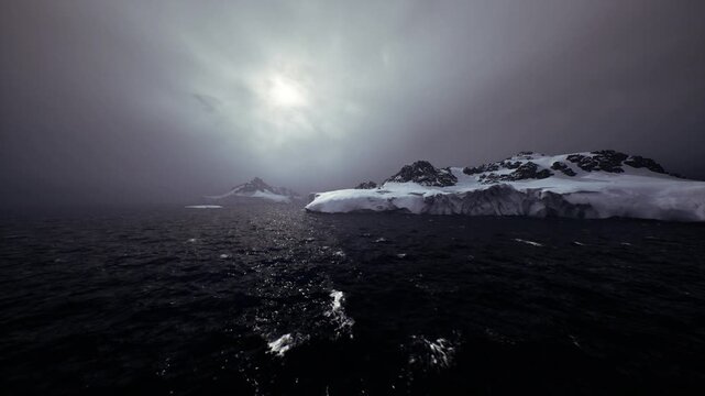moody arctic voyage under low sun and heavy cloud, rough seas with spray and whitecaps, distant ice shelf partially shrouded in mist, sense of urgency