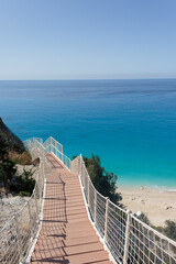 Naklejka premium Egremni beach stairway leading to ionian sea paradise