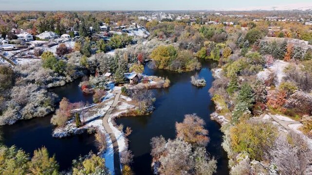 Ann Morrison Park Aerial Drone Shot Featuring Snowy Autumn Trees and Winding Paths in 4k