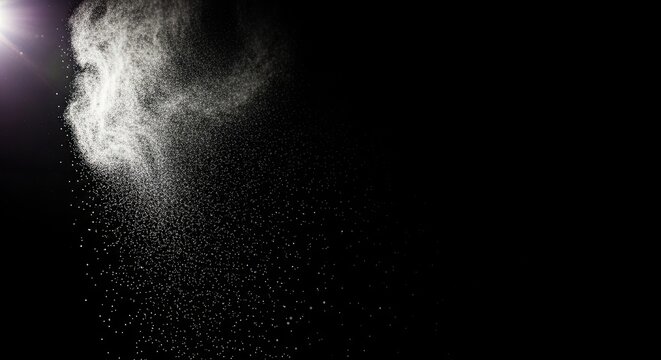 Abstract Burst of White Powder Particles Against a Dark Background.