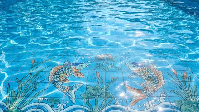 decorative koi fish tile pattern in a swimming pool