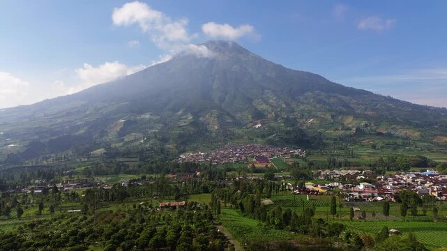 Aerial drone footage showcasing the majestic landscape of Mount Sumbing, an active stratovolcano and the second-highest volcano in Central Java, Indonesia.