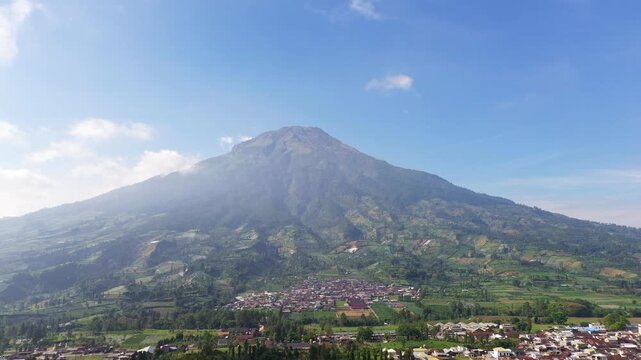 Aerial drone footage showcasing the majestic landscape of Mount Sumbing, an active stratovolcano and the second-highest volcano in Central Java, Indonesia.