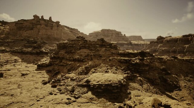 sepia desolate rockscape evokes lonely horizon, cracked earth and eroded ledges under hazy sunlight, dramatic tone suited for dystopian film location, album art