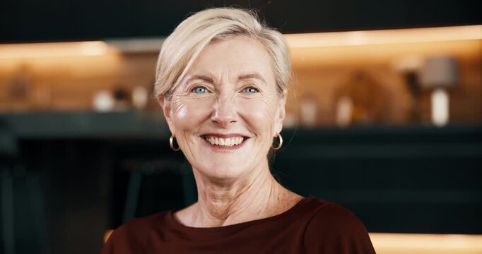 Wellness, face and senior woman in house with smile, positive attitude or optimistic for weekend break. Happy, portrait or elderly person with good mood, confidence or satisfaction in retirement.