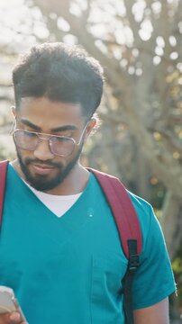 Medical student, phone and walk with man on campus for learning schedule, doctor residency and college. Healthcare internship, contact and medicine program with person in university for text message