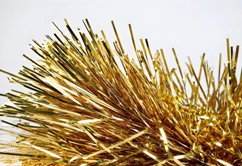 Fototapeta premium gold tinsel decoration on white background