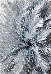 Fototapeta premium Silver Christmas tinsel close-up on white background