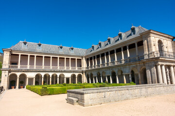 Obraz premium San Lorenzo del Escorial, Madrid, Spain; April 15, 2026: 16th-Century Renaissance Herrerian Gallery and Friars Garden at the Royal Monastery of San Lorenzo de El Escorial