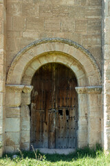 Fototapeta premium Southern Romanesque Carved Portal with Wooden Door from the 13th Century Hermitage of San Pedro in La Losa, Segovia, Castile and Leon, Spain