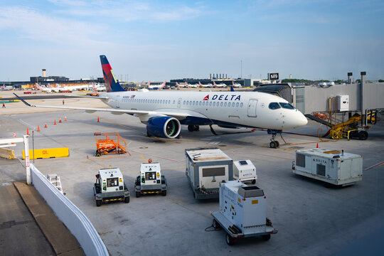 Chicago, Illinois, USA - June 15, 2025: Plane arrival of Delta airline. Departure and arrival at airport terminal. Airplane terminal. Travel by plane. Airport terminal. Aviation business