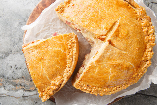 Pizzagaina, also known as Easter pie, pizza rustica, pizza chiena, or pizza gain, is a savory meat pie that is traditionally eaten on Easter morning closeup. Horizontal top view from above