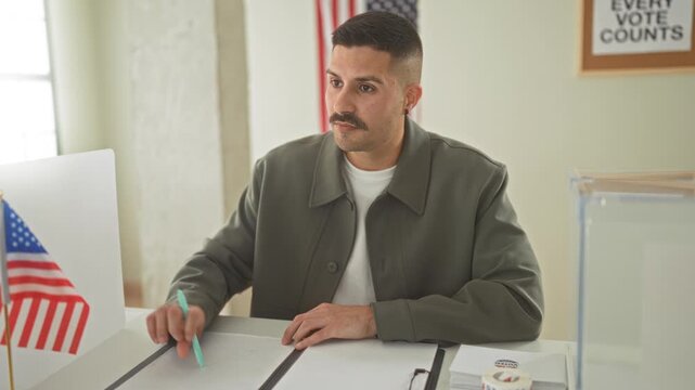 Man placing ballot envelope on table in voting building with visible hand and pen, american flag nearby; civic duty pride.