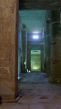 Massive stone pillars and hieroglyph-covered walls inside the Abydos Temple create a powerful atmosphere of ancient ritual and history. Egypt
